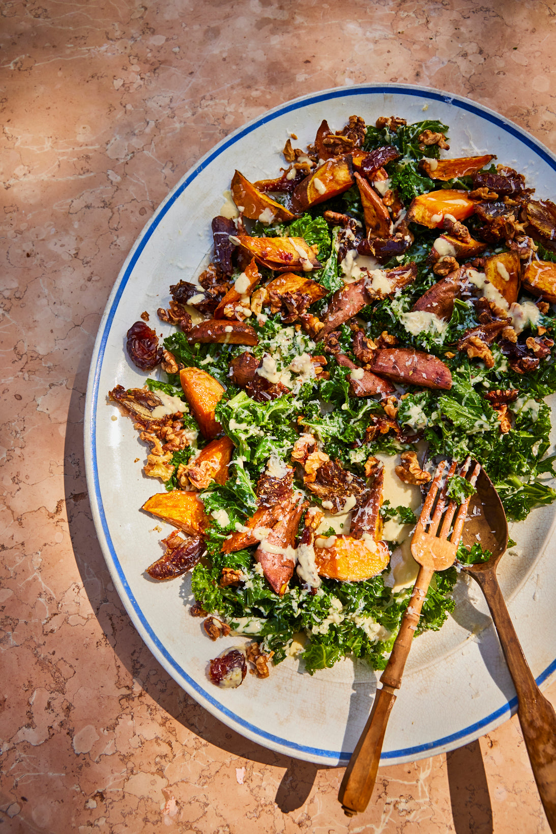KALE, SWEET POTATO, DATE AND WALNUT CHOPPED SALAD WITH A PARMESAN TAHINI DRESSING