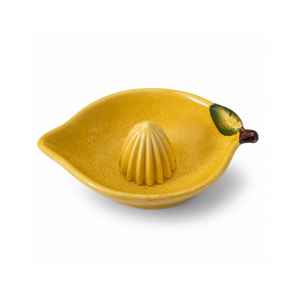 Yellow lemon-shaped ceramic juicer on a white background