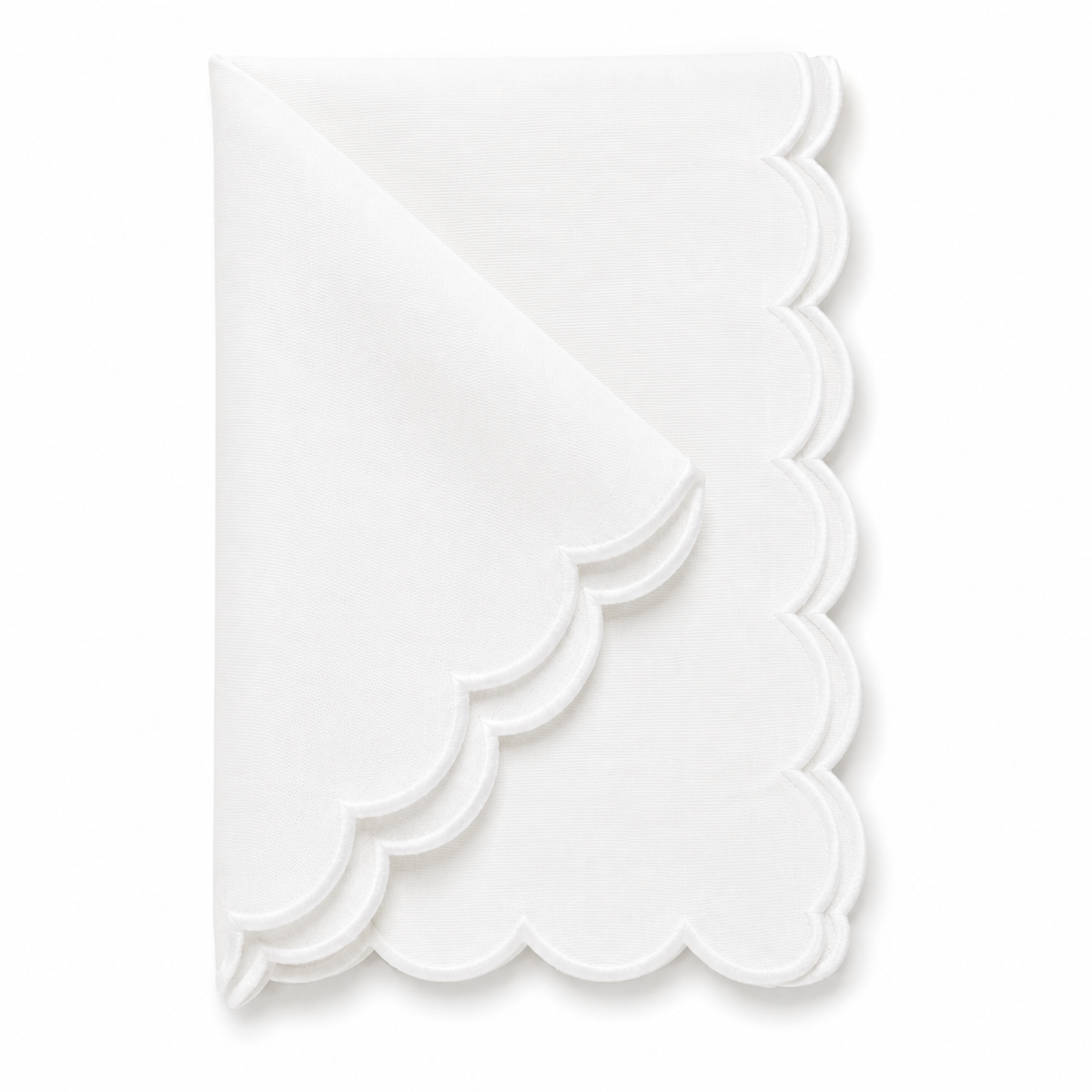 A folded white paper napkin with a scalloped edge, displayed on a clean white background.