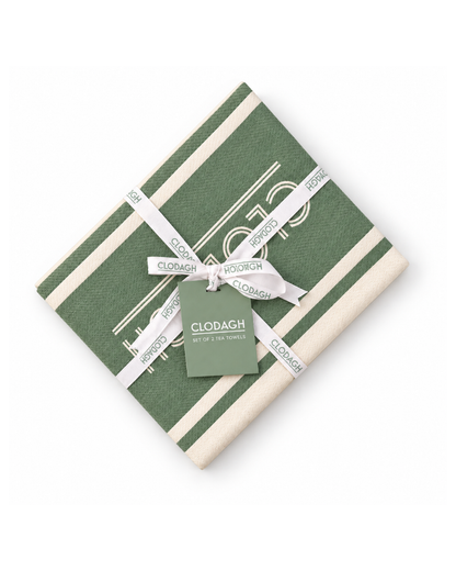 A folded green and cream striped fabric item, likely a napkin or small table linen, wrapped with a white ribbon printed with the brand name 'CLODAGH' and a matching green tag, shown on a plain white background.