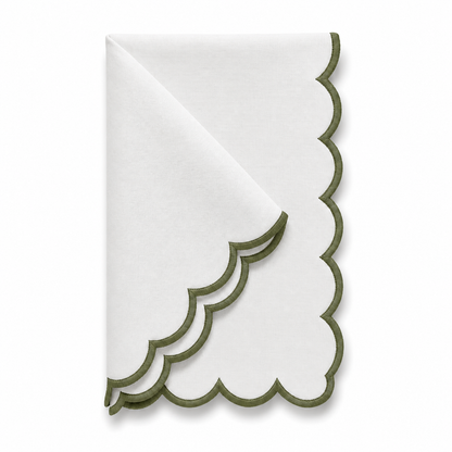 A folded white paper napkin with a scalloped edge and olive green trim, shown on a clean white background.
